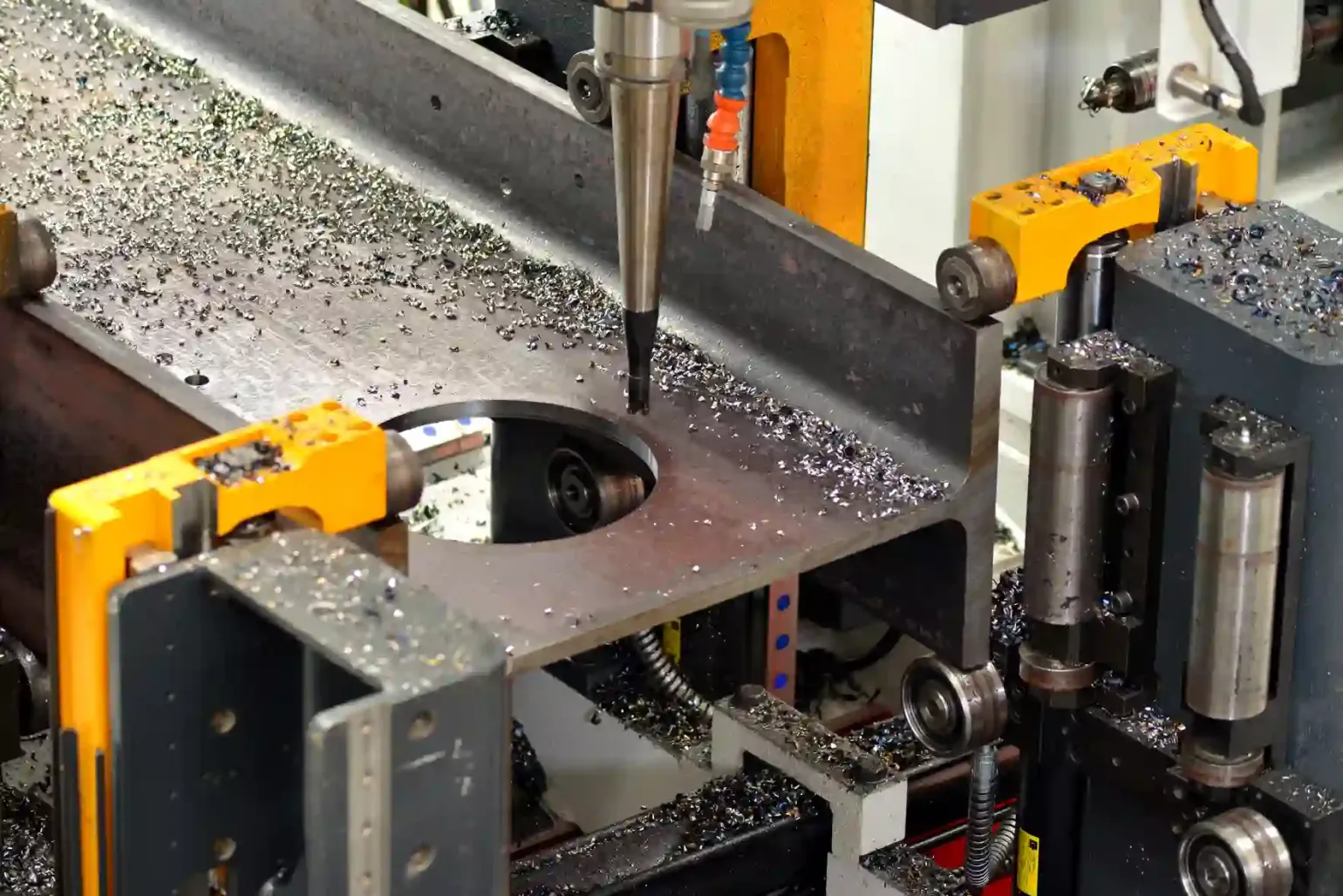 Drilling the Steel


	Drill a pilot hole: Use a drill bit that’s smaller than the hole you ultimately want to drill in the metal to drill a pilot hole. The pilot hole will act as a guide, making it easier to use larger drill bits.
	Gradually increase drill bit size: After drilling the pilot hole, gradually increase the drill bit size until you reach the desired hole diameter. Doing this methodically will help to preserve your drill bits’ lifespan and avoid excessive heat build up.
	Apply consistent pressure: Apply firm, consistent pressure to keep the drill bit engaged with the steel. Do not use too much force, as this could lead to the drill bit overheating and breaking.
	Use coolants and lubricants: Use coolants and lubricants occasionally throughout the drilling process. This will help to reduce friction, remove heat, and ensure smooth drilling.
	Deburr and smooth edges: Use a file or deburring tool to remove burrs and smooth the hole’s edges.
	Clean and examine the hole: Clean the drilled hole to remove any metal shavings or other debris. Examine the hole for flaws or inconsistencies that could affect its usability. Adjust or re-drill, if necessary.

